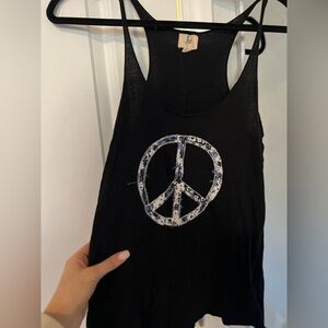 …Lost peace sign tank with blue and white textured peace sign